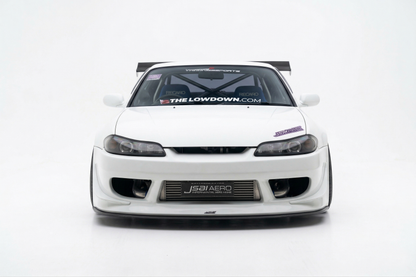 Front view of a white Nissan S15 Silvia with JSAI Aero front bumper, front lip, wide fenders, exposed intercooler and GT wing for JDM drift, street and track builds.