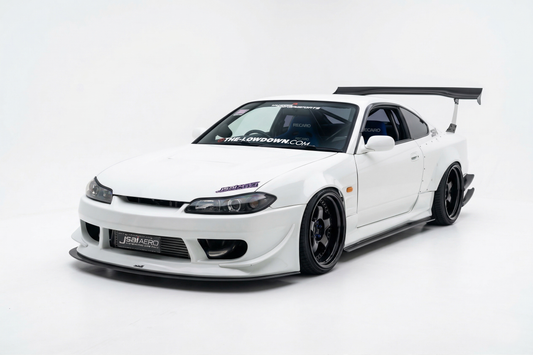 White Nissan S15 Silvia with JSAI Aero front bumper, front lip, side skirts, wide fenders, deep-dish wheels and GT rear wing for JDM drift, street and track builds.