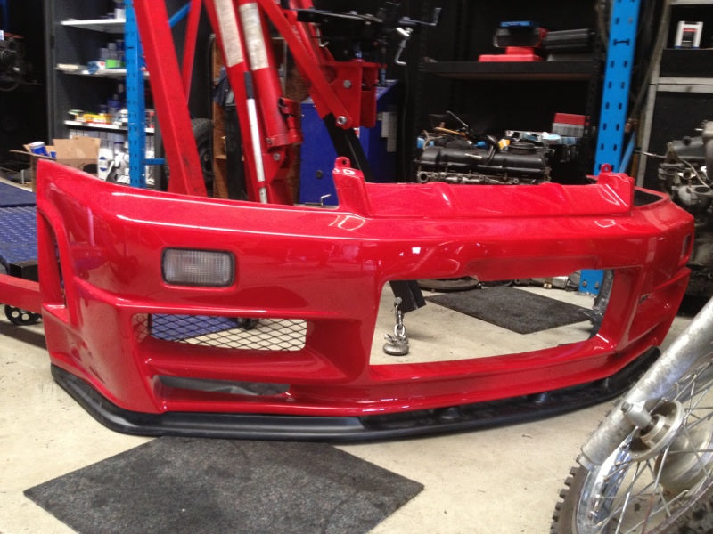Red Nissan 180SX front bumper with front lip and mesh grille for performance aero body kit upgrade