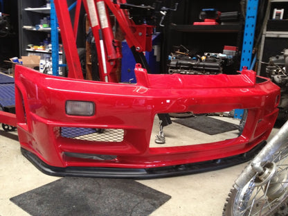 Red Nissan 180SX front bumper with front lip and mesh grille for performance aero body kit upgrade