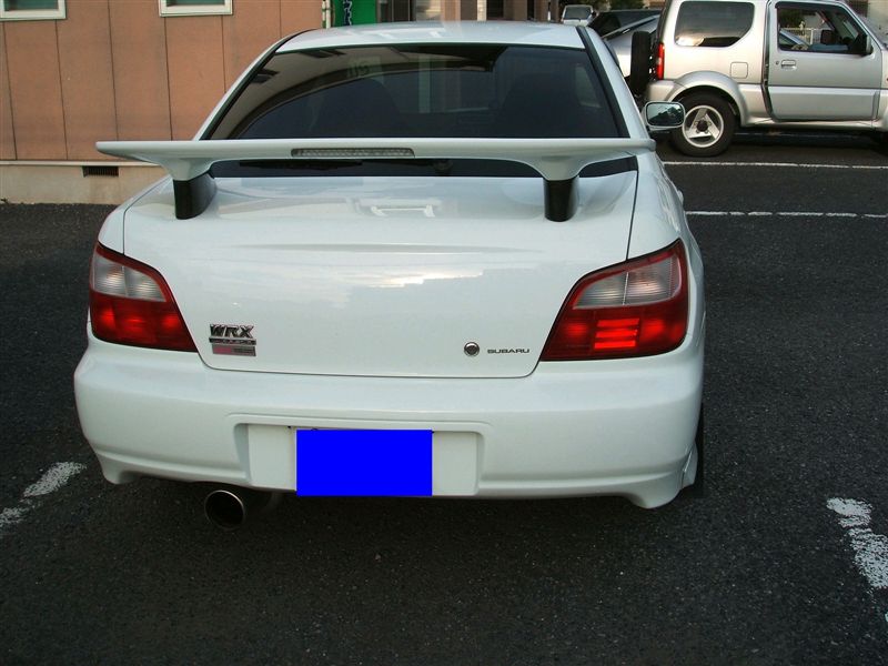 Rear view of Subaru Impreza GDB WRX with 90mm Zero Sports style wing risers by JSAI Aero installed aftermarket spoiler risers
