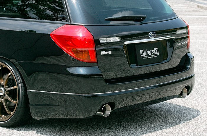 Subaru Legacy wagon rear bumper detail with pod extensions and exhaust tips