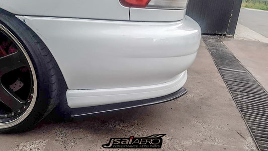Subaru rear bar pod extensions black unpainted installed on rear bumper