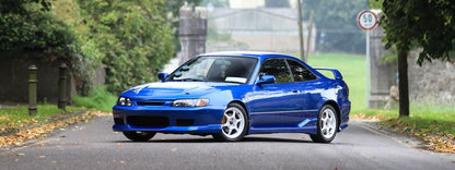 Toyota AE111 Corolla Levin street build front view, modified JDM car with aftermarket wheels and clean exterior styling
