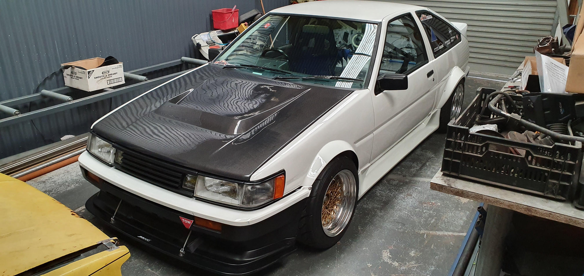 Toyota AE86 50mm OEM style front fenders, aftermarket widebody upgrade designed for enhanced wheel clearance and aggressive stance