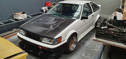 Toyota AE86 50mm OEM style front fenders, aftermarket widebody upgrade designed for enhanced wheel clearance and aggressive stance
