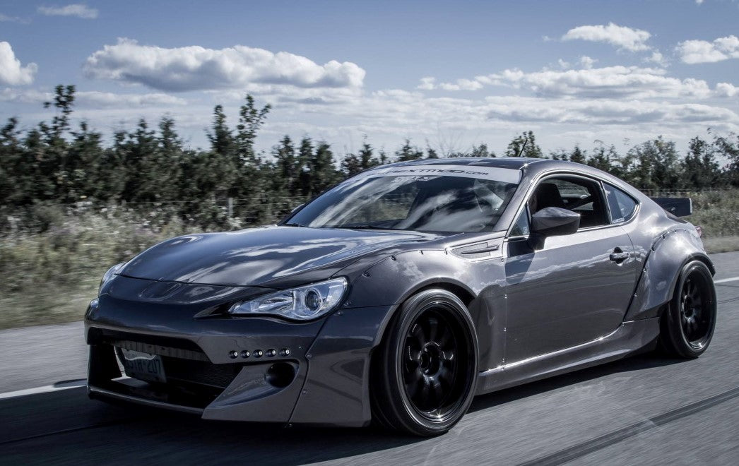 Rocket Bunny V2 widebody kit Toyota GT86 Subaru BRZ JSAI Aero front angle driving shot