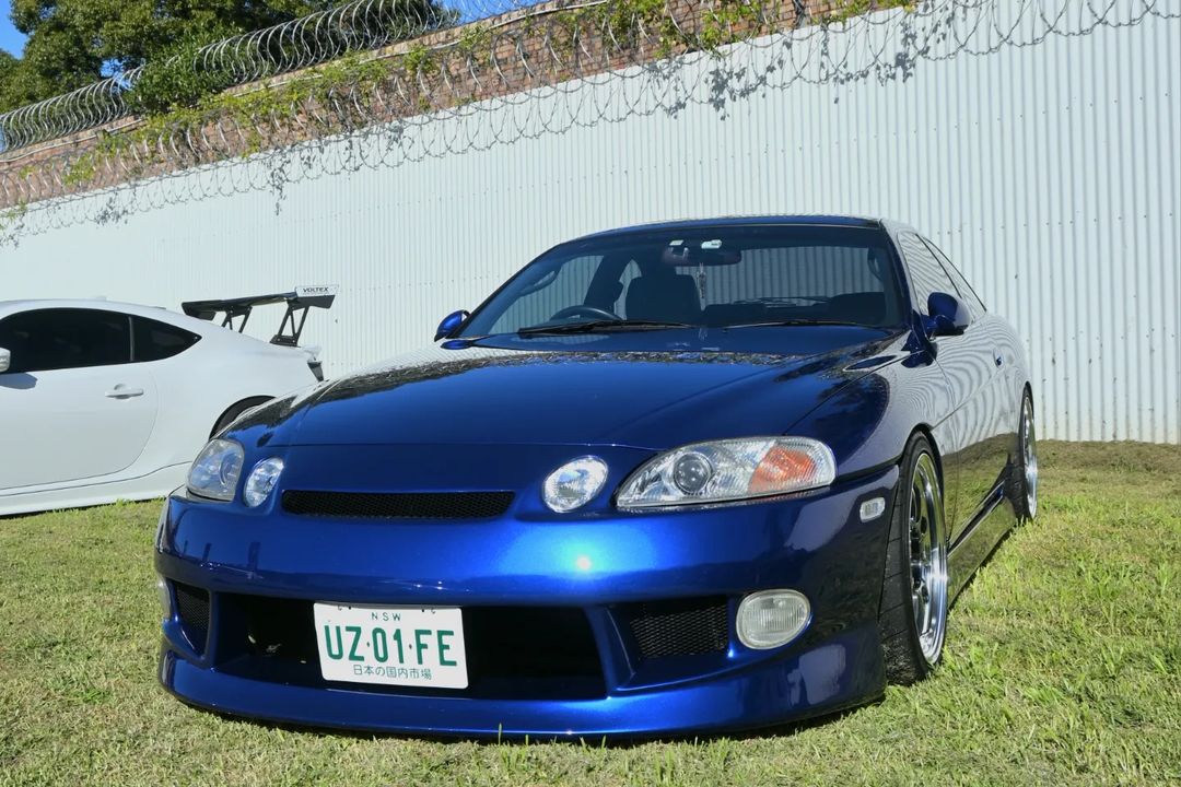 White Toyota Soarer with custom body kit, front bar and side skirts, modified performance car build exterior
