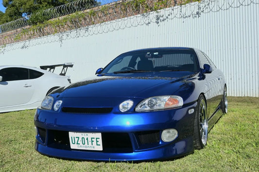 White Toyota Soarer with custom body kit, front bar and side skirts, modified performance car build exterior