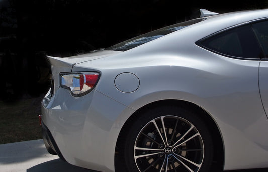 rear bumper spoiler wing on white Toyota sports car installed