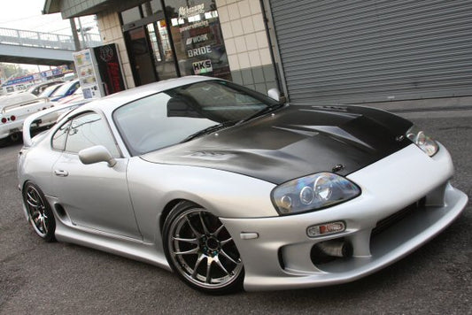 Toyota Supra JZA80 with Top Secret front bar installed, aftermarket body kit upgrade enhancing front-end styling and performance look